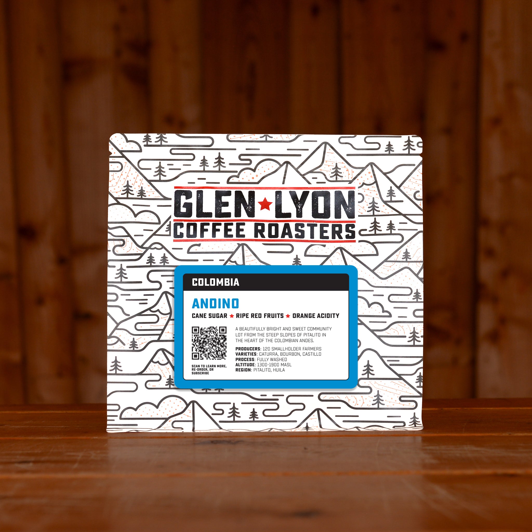 A 250g bag of Colombia Andino speciality coffee from Glen Lyon Coffee Roasters sitting on a wooden table.