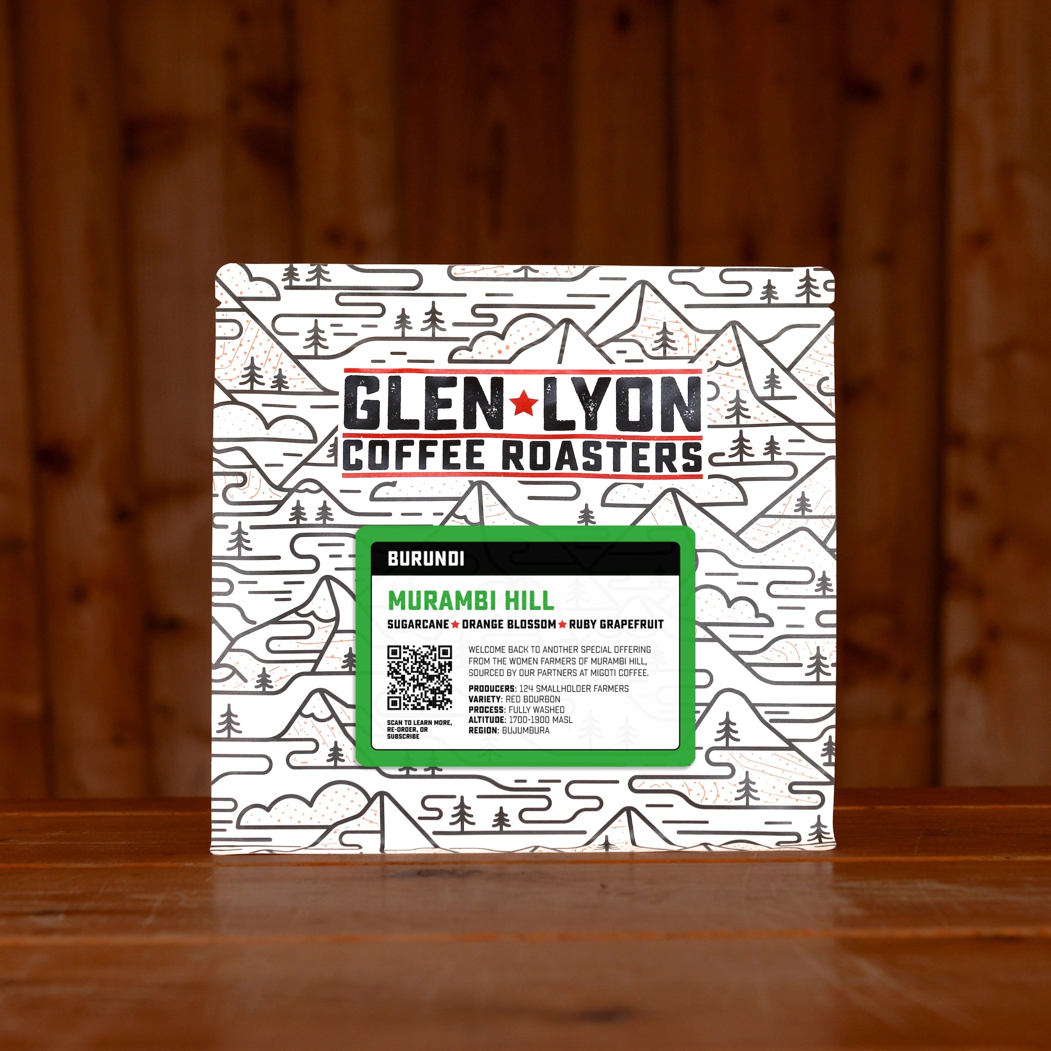 A 250g bag of Burundi Murambi Hill speciality coffee from Glen Lyon Coffee Roasters sitting on a wooden table.