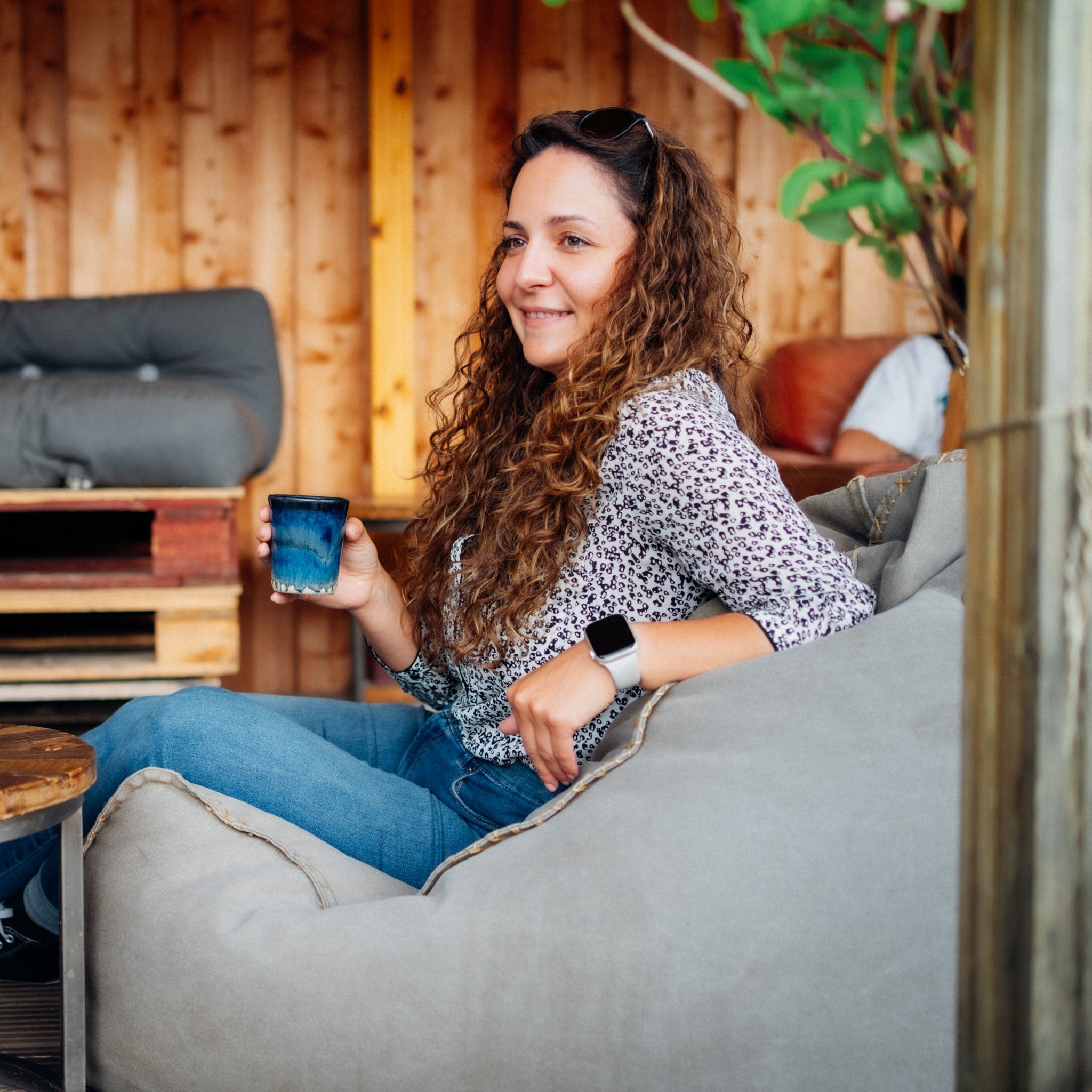 A customer enjoying a coffee outside the Glen Lyon Coffee roastery cafe