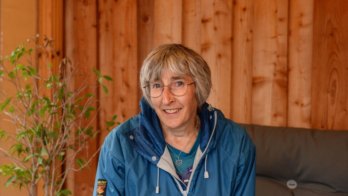 Anna Sibbald sitting on a sofa outside Glen Lyon Coffee Roasters.
