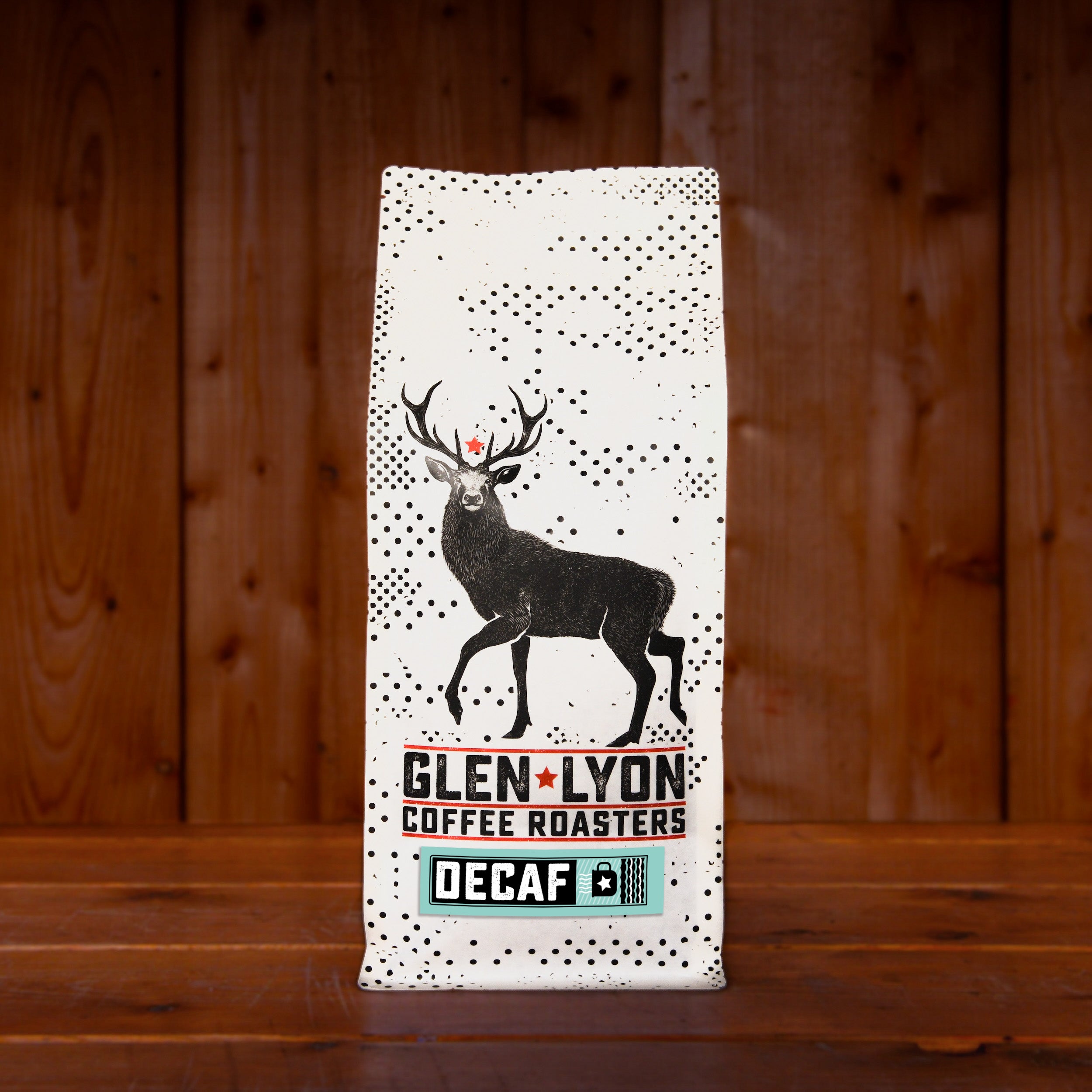 A 1kg bag of Glen Lyon Coffee Roasters' Decaf speciality coffee sitting on a wooden table