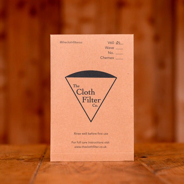 A cloth coffee filter displayed on a wooden table