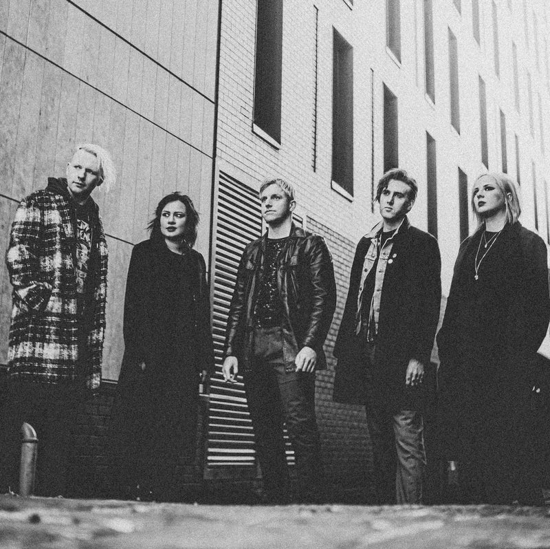 A publicity shot of the band Echo Machine on a city street