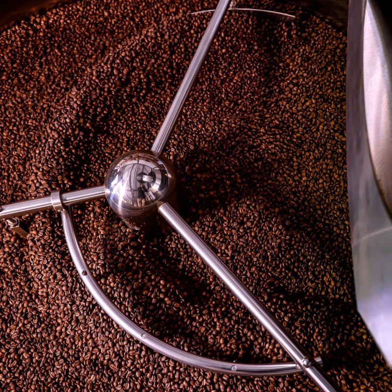 A shot of the Glen Lyon Coffee Roasters' Probat speciality coffee roasting machine from above with coffee in the cooling tray