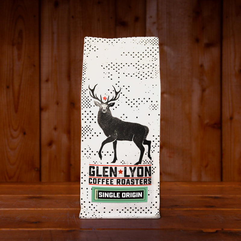 A 1kg bag of Glen Lyon Coffee Roasters' Single Origin speciality coffee sitting on a wooden table