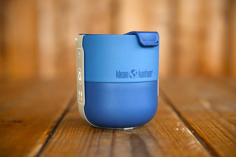 The blue Lowball tumbler has a two-tone finish. The bottom and lid are a deeper blue and the top of the cup is electric blue.