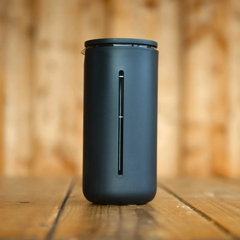 A black Timemore Cafetiere with a black matte outer finish and a window through to the glass interior. There is a black lid.